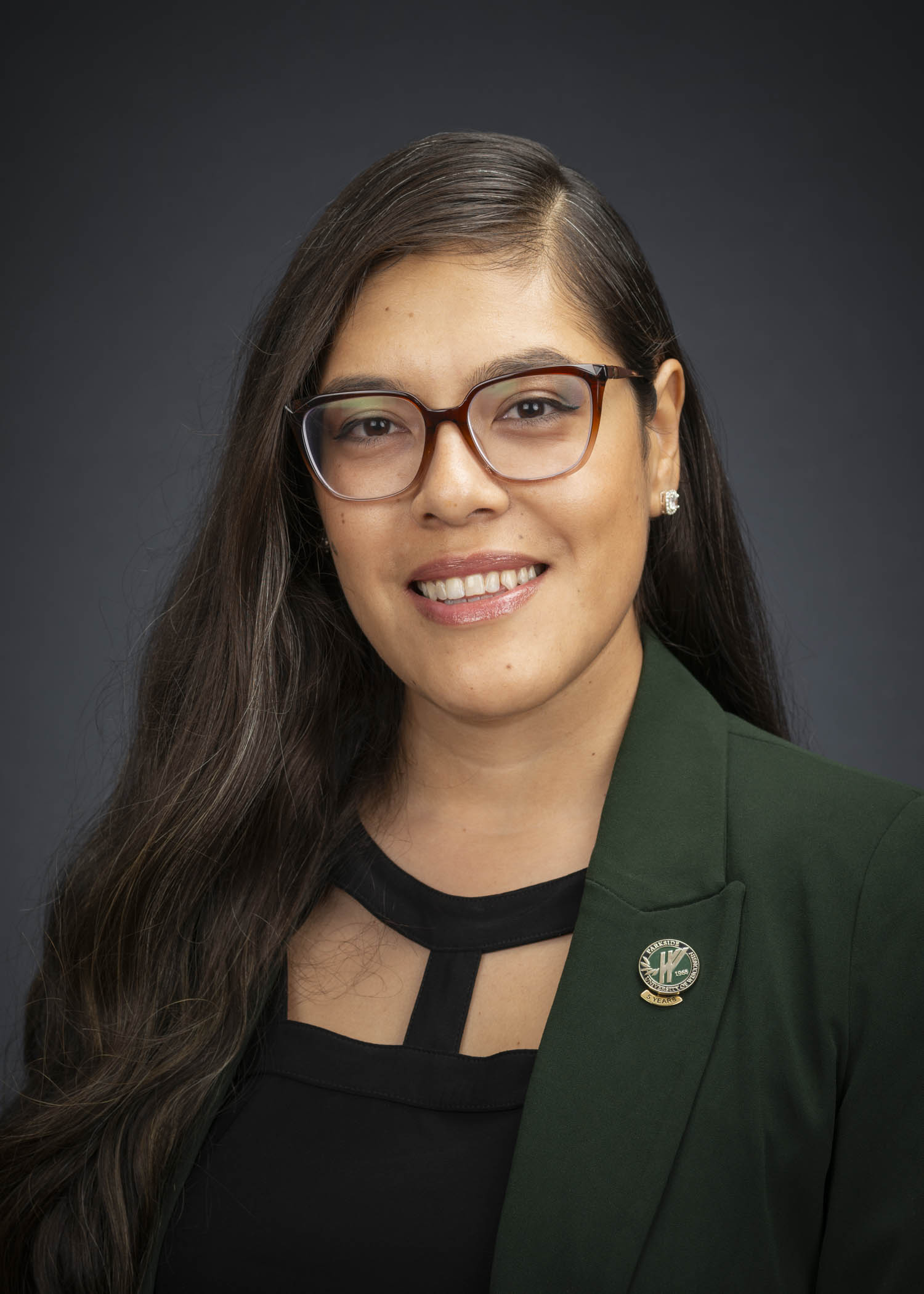 Gutierrez_Giovanna2 Latina woman with large frame glasses in green blazer
