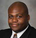 JGarrett headshot (1) Bald Black Male