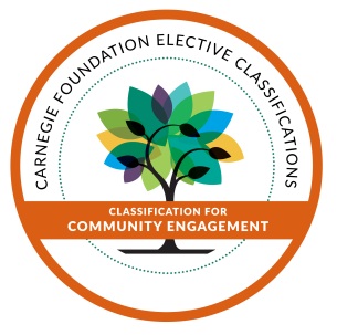 2026 Carnegie Community Engagement Seal Round seal with orange border and colorful leaves on a tree to denote UW-Parkside Classification for Community Engagement award from the Carnegie Foundation