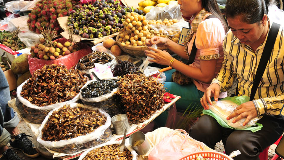 Image of Asian women selling food in a market