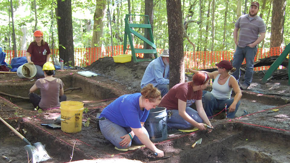 Image of student's working on a digging site