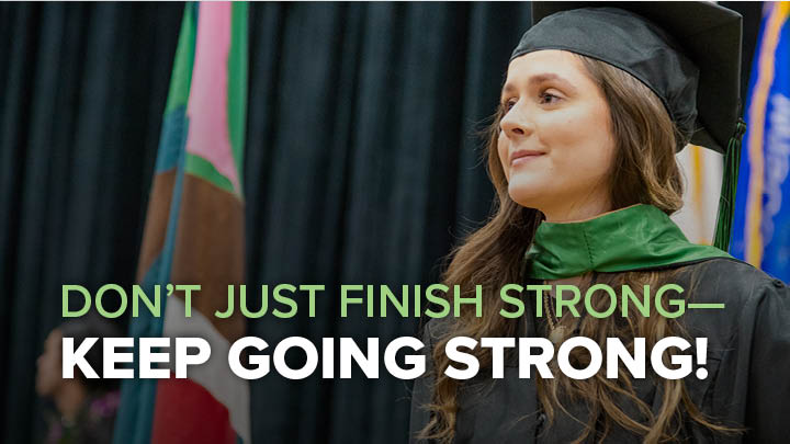 image of a Parkside Graduate after having her graduate cape installed at commencement