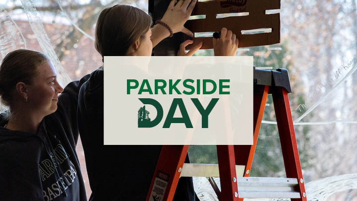 Parkside Day Logo in the Background people painting bird collision prevention designs