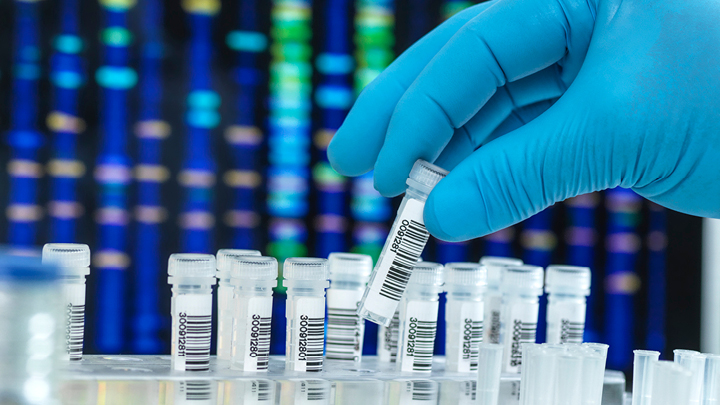 image of test tubes with DNA digital sequence in the background