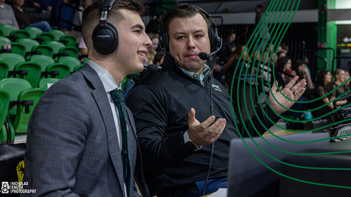 Image of a Sport Management Grad student doing game commentary