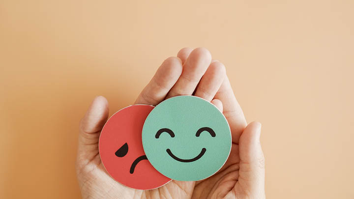 Decorative Handing holding happy and sad faces