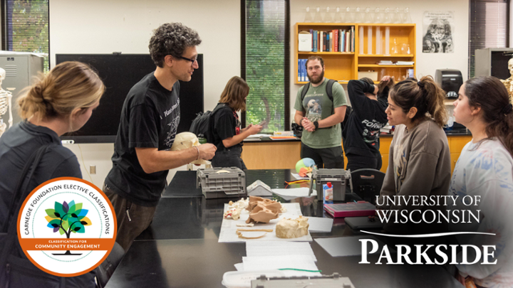 image of students and a faculty member in a classroom.Carnegie and Parkside logo