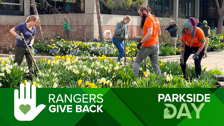 Image of people outside on Parkside grounds cleaning up plants