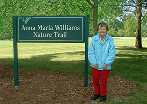 anna-maria-with-sign-red-pants