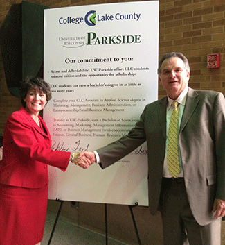 Chancellor Debbie Ford and CLC President Jerry Weber celebrate new academic agreements