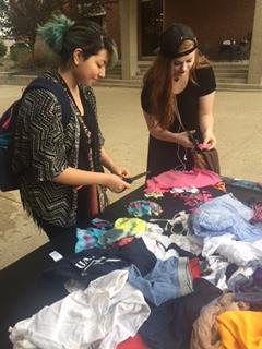 UW Parkside students Gia Reeves and Damaris Maldonado cutting up undergarment for the project
