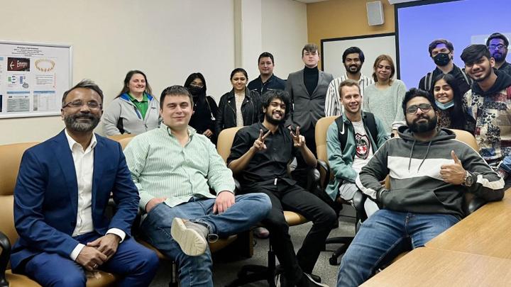 Dr. Abey Kuruvilla, far left, Nick Koenen, seated next to Dr. Kuruvilla, and the UW-Parkside MBA business operations class.