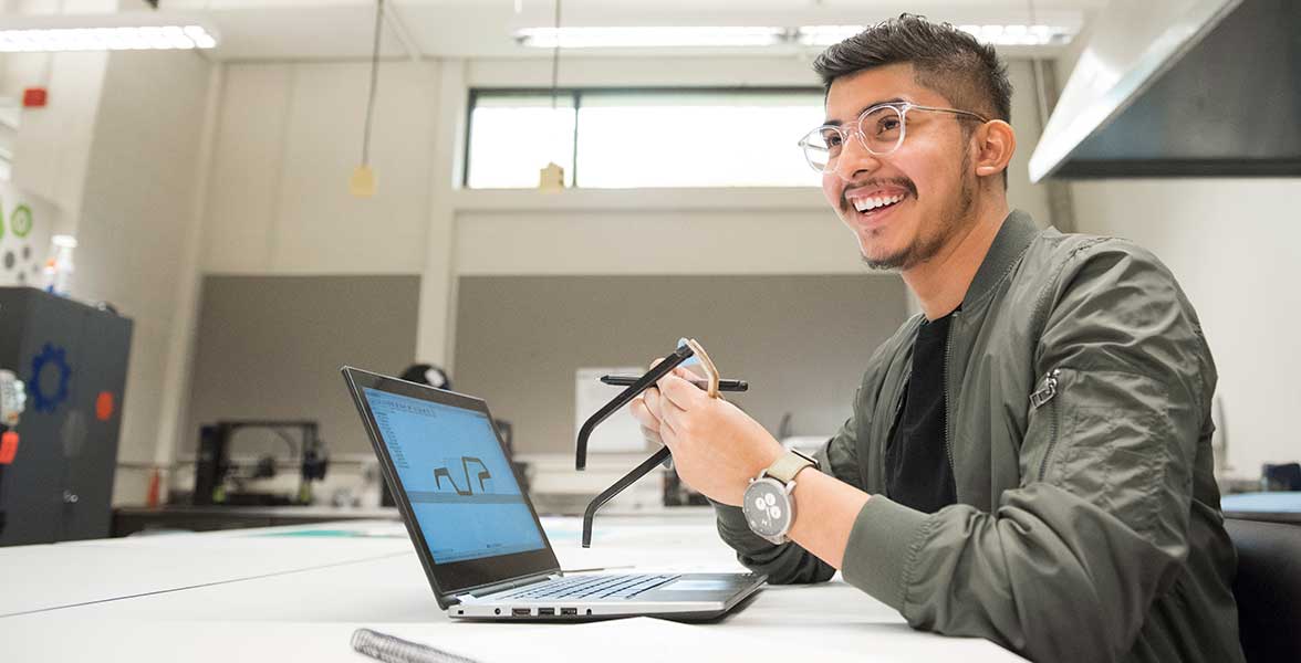 A student fabricates a eye glasses designed in the Digital Design and Fabrication lab