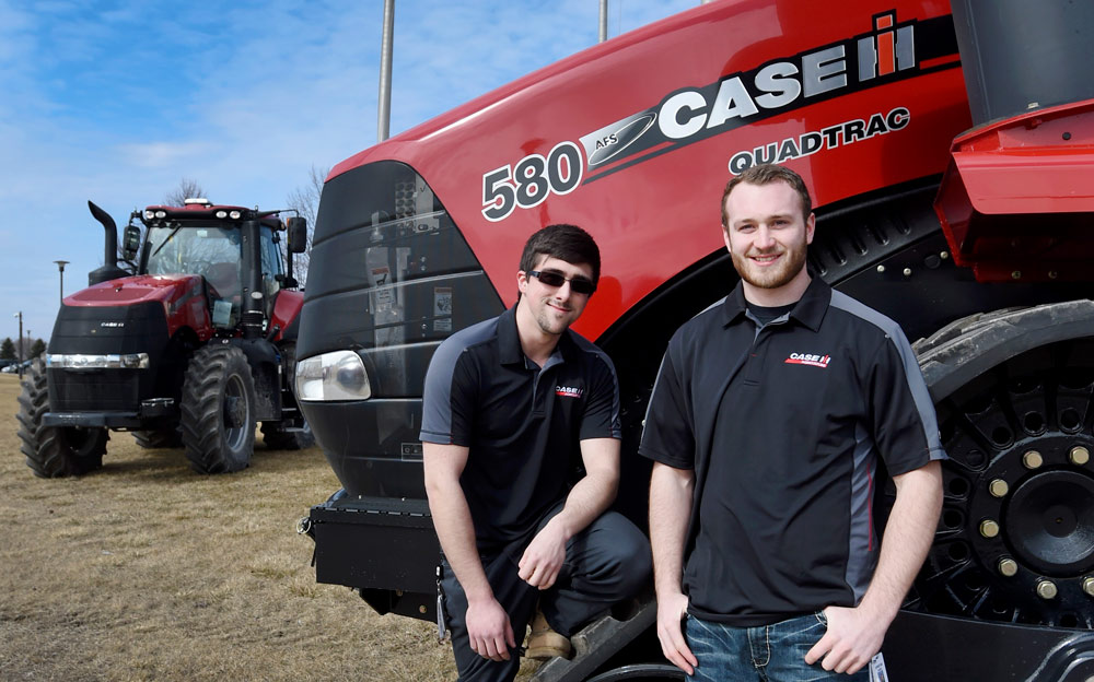 Students in front of Case tractors. Photo courtesy of The Journal Times 