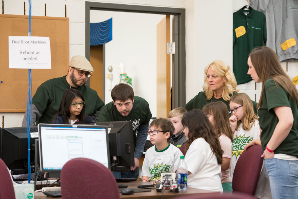 Students learn how to program robots Students learn how to program robots