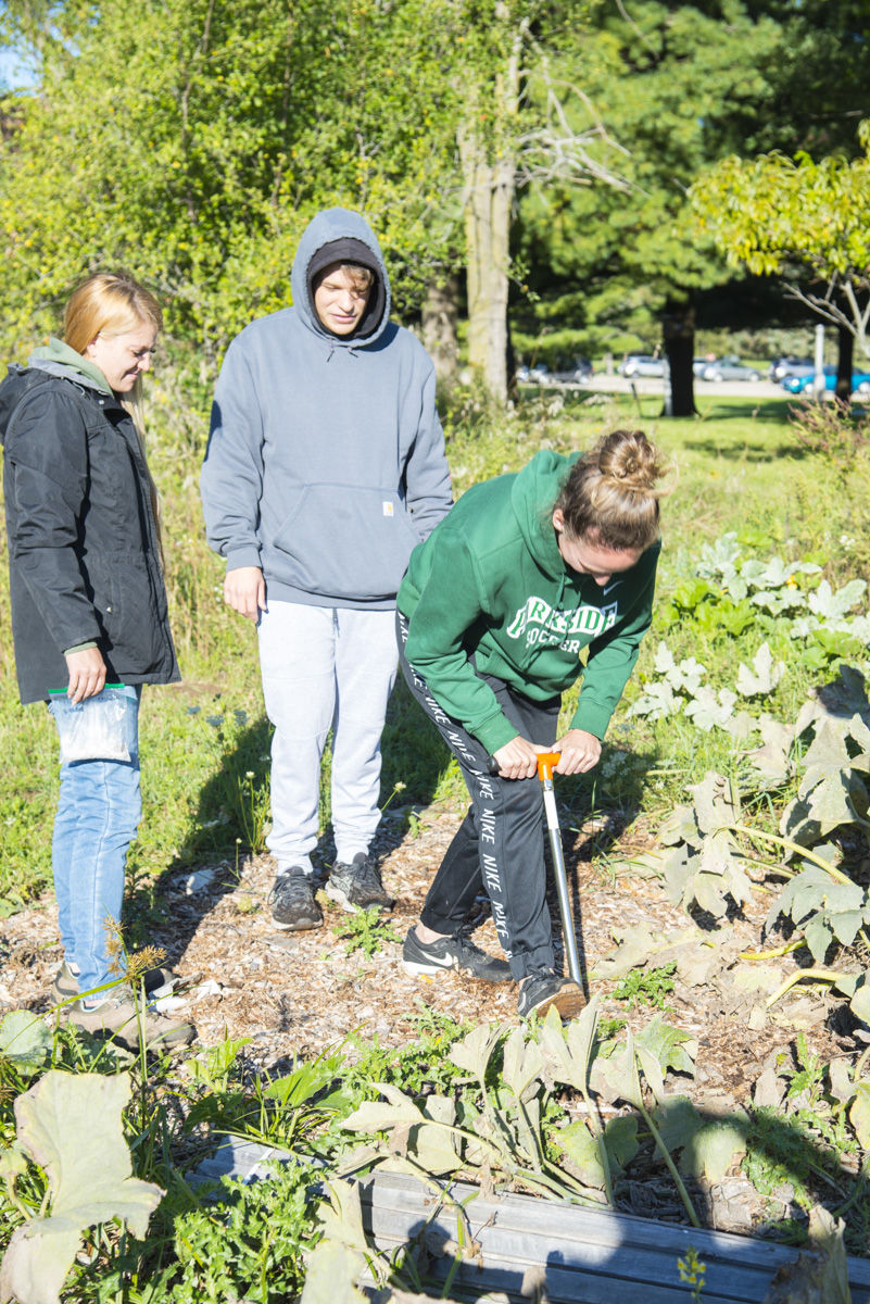 Enviromental Studies class does soil sampling in the community garden.