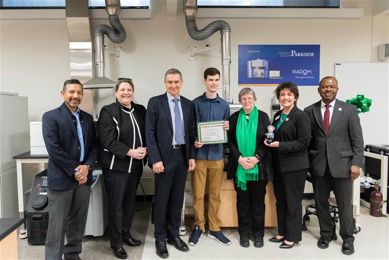 From left to right: Ashok Menon-Radom Founder, Christine Rivera-Radom Director, Product Management - Spectroscopy, Roman Bensen-Radom CEO, Jonah Tetrick-Fellowship Recipient, Lori Allen, Chancellor Ford, Dean Otu