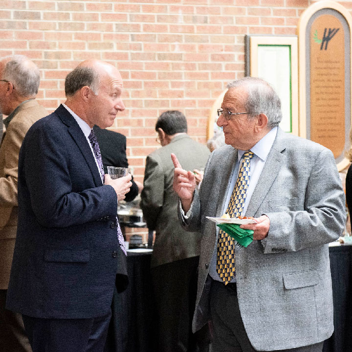 Craig Young ’76 and Emeritus Professor of Computer Science &amp; Engineering Dr. George Perdikaris.