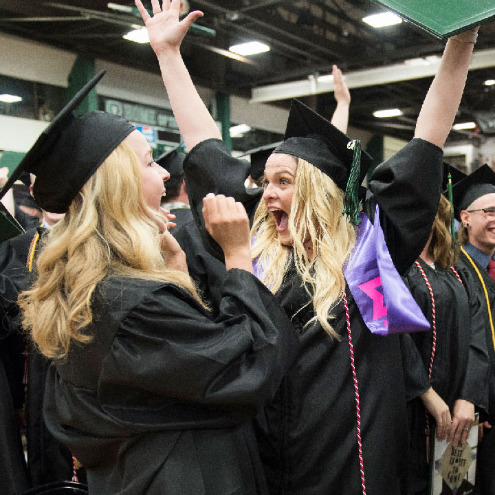 two happy graduates