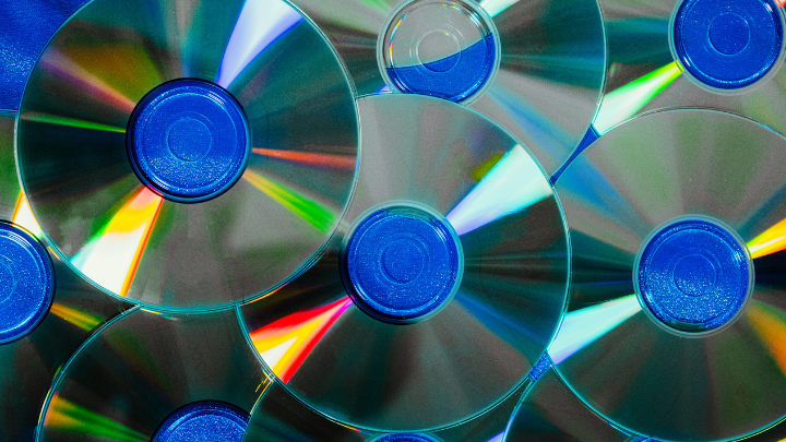 Photo includes multiple compact discs.