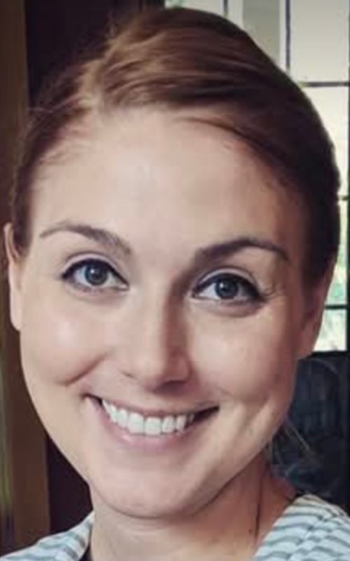 Headshot of woman smiling at a camera
