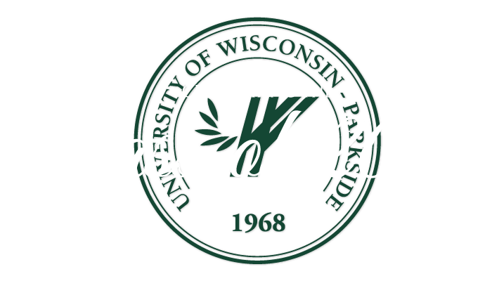 Celebrating the Class of 2021 in front of the university seal