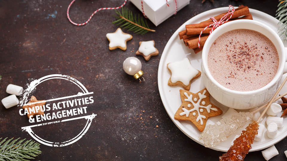 table with hot coco and holiday cookies