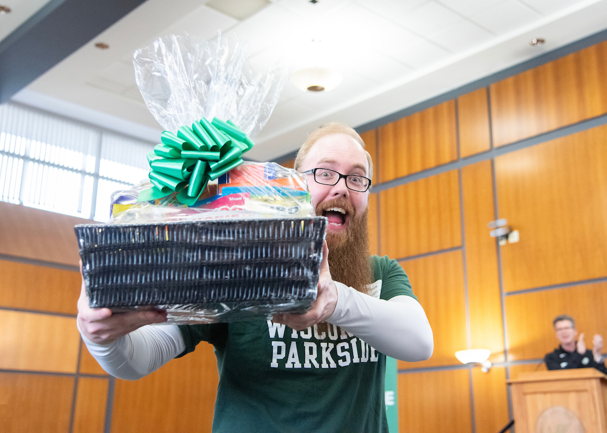 A UW-Parkside Alumni wins a gift basket at the Ranger Reunion