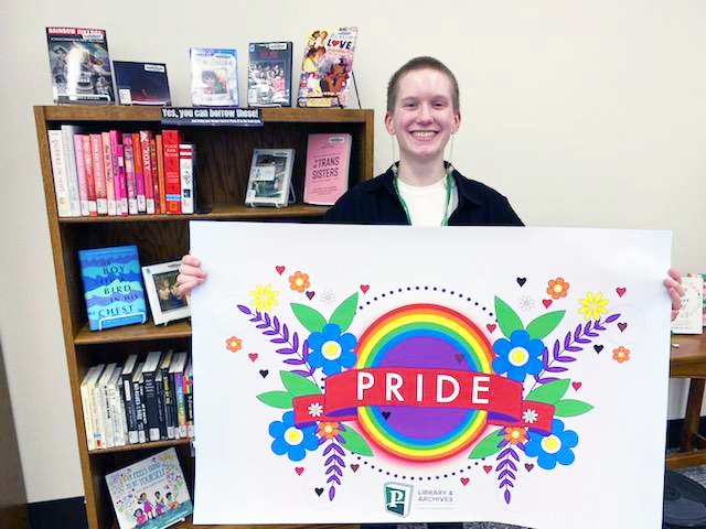 Olivia Weippert with her Pride banner