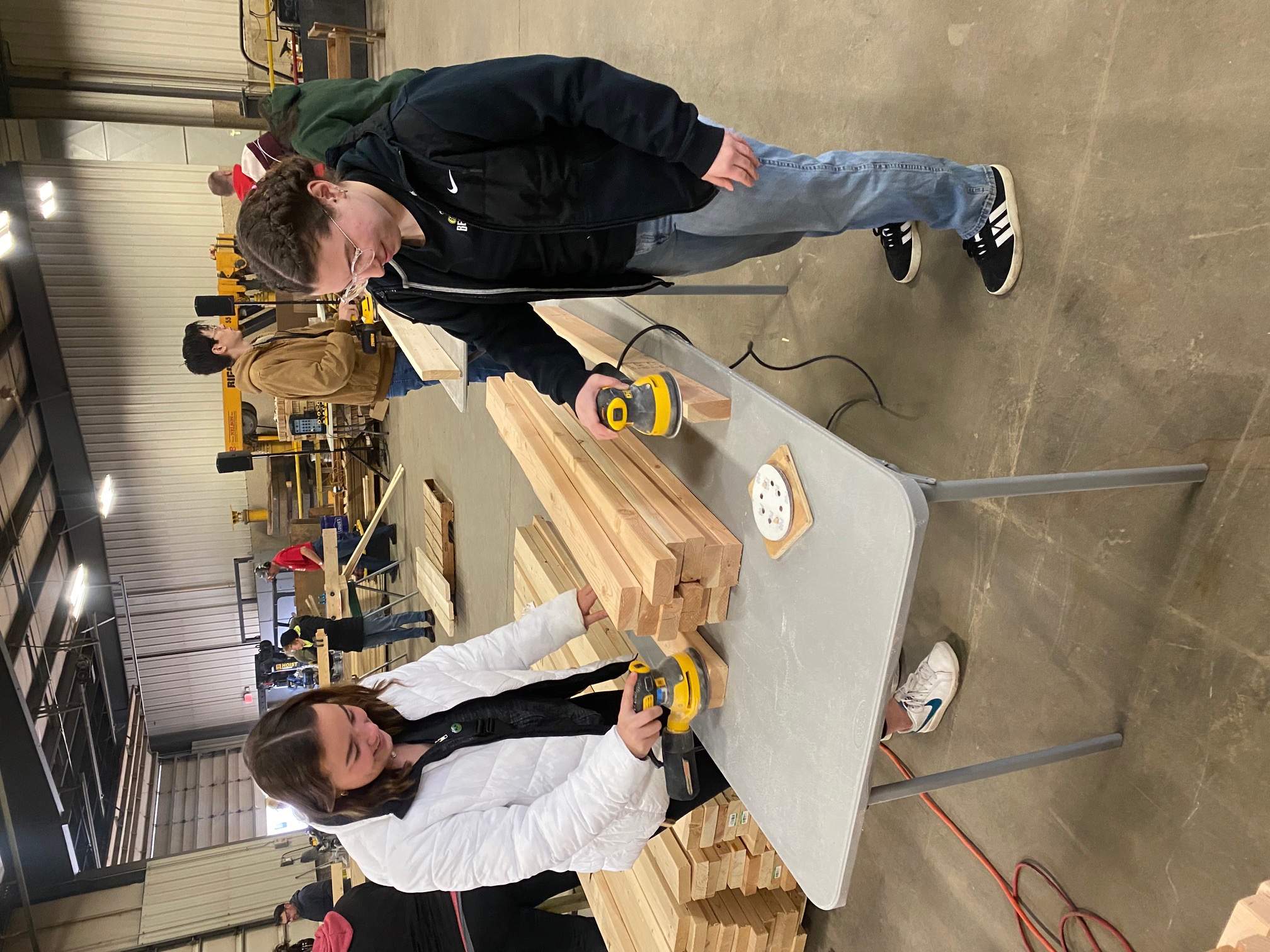 Callahan scholars Maddie Lallo (Left) and Judea Mahboub (Right) help build beds for kids.