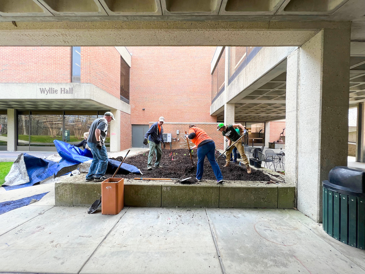 Volunteers plant flowers during Parkside Day