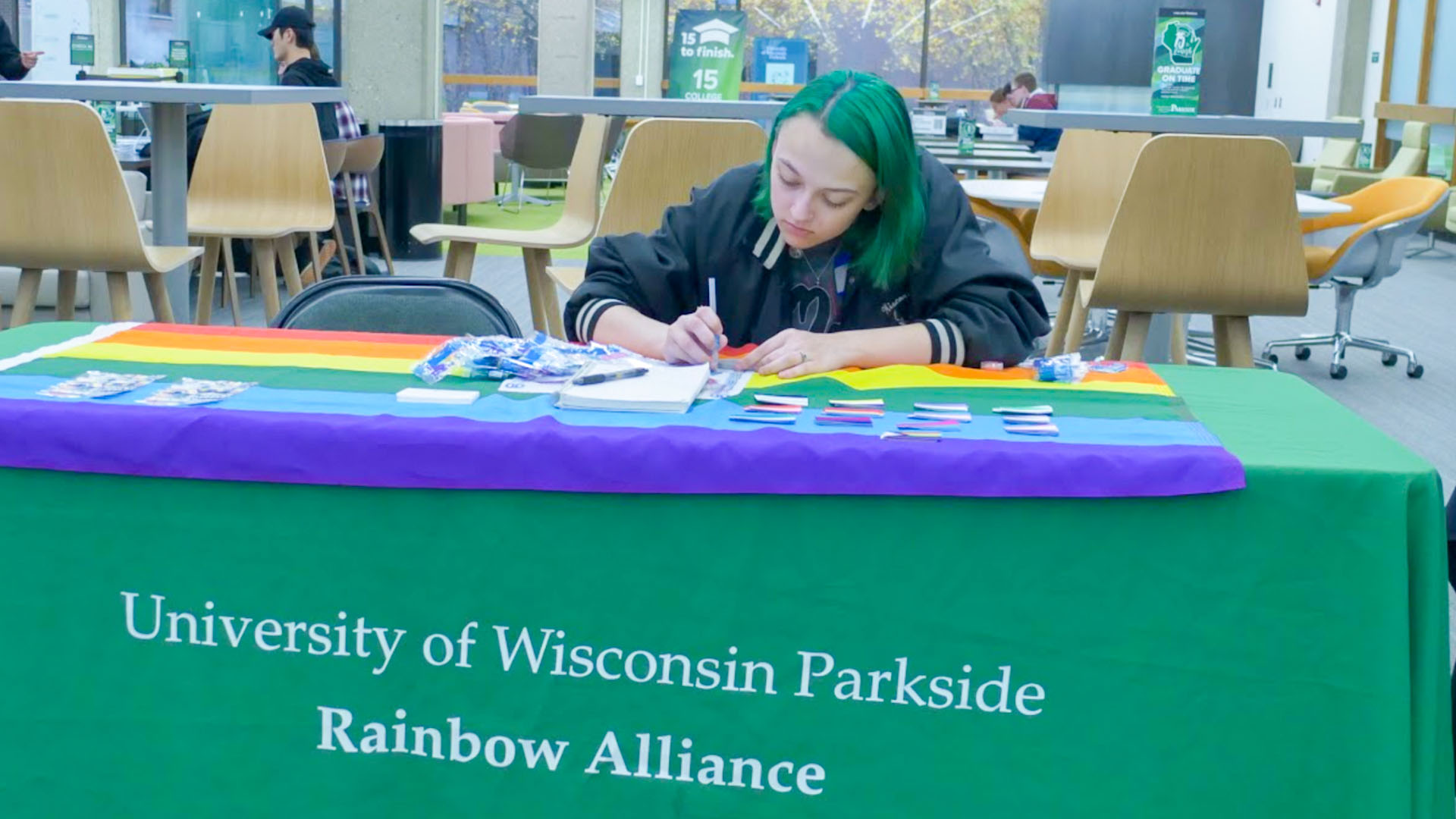 A table showcasing the Rainbow Alliance, an organization based around supporting and uplifting members of the LGBTQ  community.