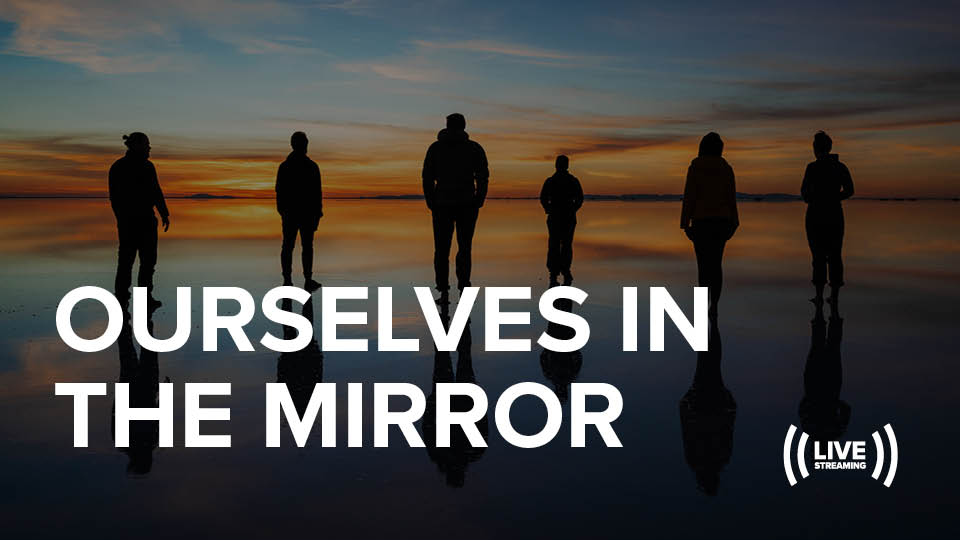 Image of the silhouette of people and their reflection along the water