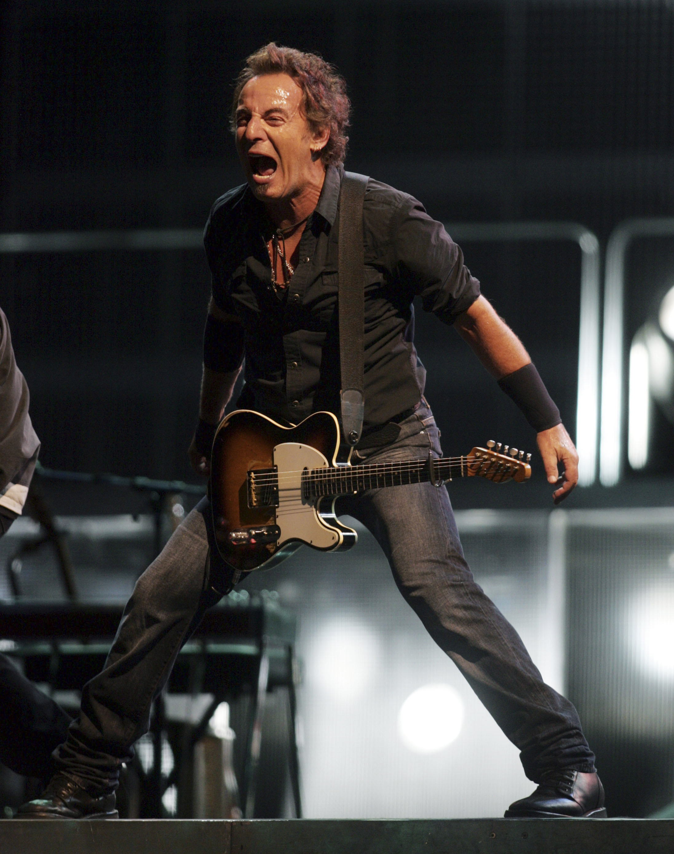 Bruce Springsteen and the E Street Band perform in Veterans Park in Milwaukee at the 105th anniversary of the Harley-Davidson Company.”  September 1, 2006.  AF.