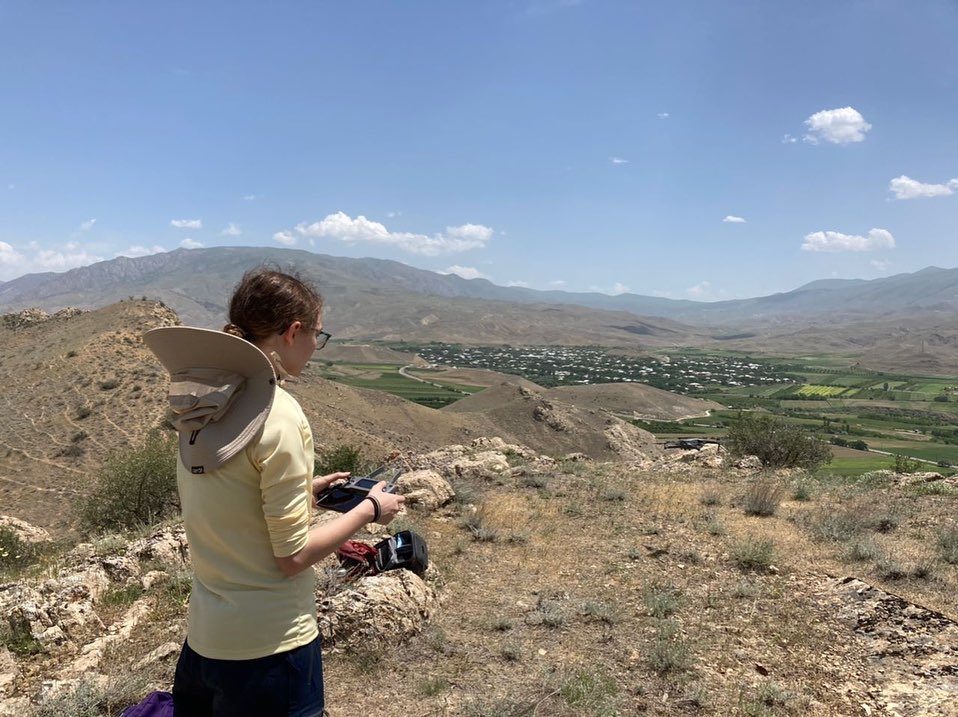 Student Ris Homar conducts an archaeological survey with a drone in Armenia. Photo by Yadian Wang.
