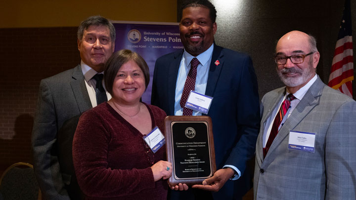 Dr. Viramontes accepts award on behalf of UW-Parkside Communication Department; pictured with Regent President Manydeeds, Regent Corey Saffold, and Interim President Falbo