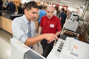 Carmine Savaglio, SC Johnson senior research scientist and UW-Parkside graduate, reviews Shimadzu instrumentation with Shimadzu Field Service Engineer David Hobbs