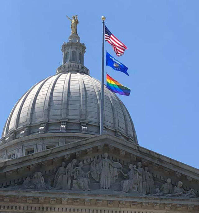 capitol flying LGBTQ flag
