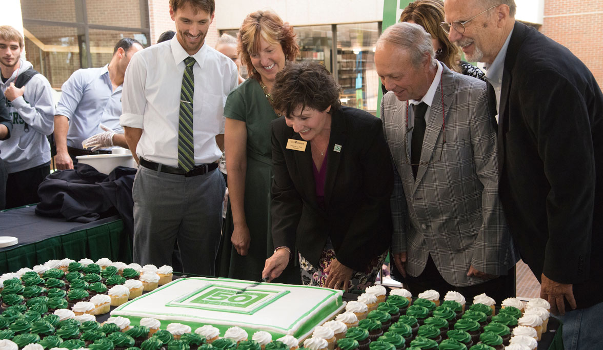 Chancellor Ford cuts 50 Year cake Chancellor Ford cuts 50 Year cake