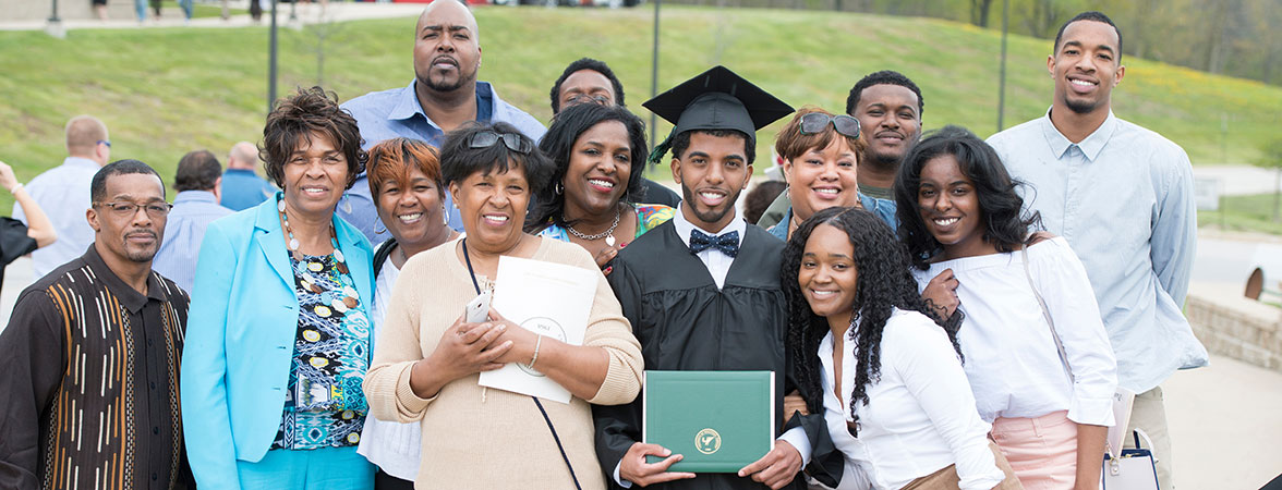 Quentin Lewis with family at commencement - wide