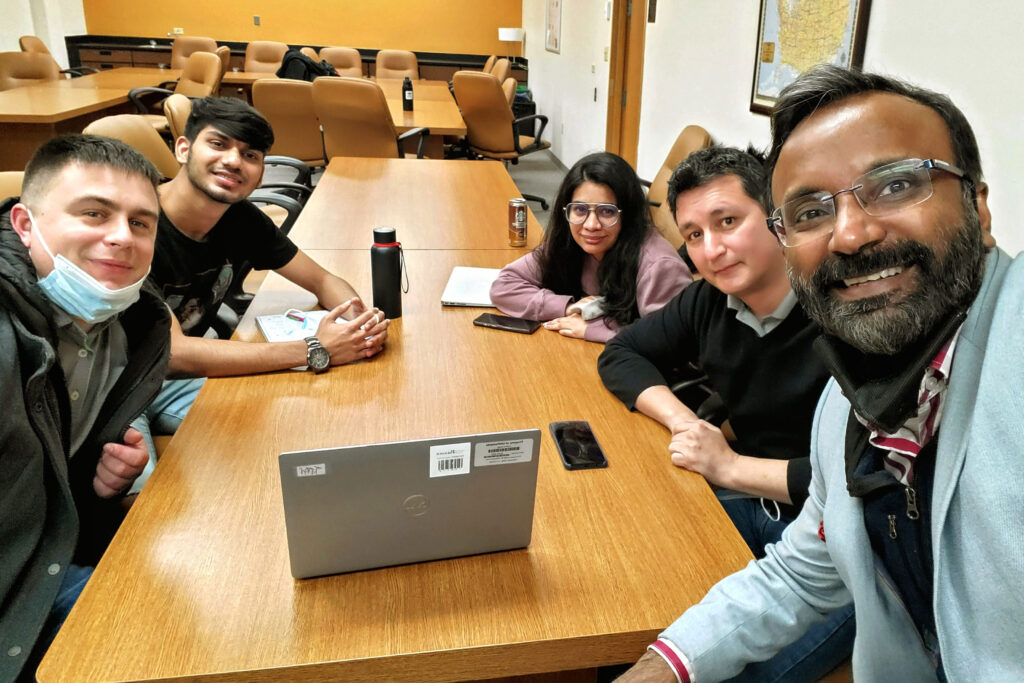 Nick Koenen, left, and Dr. Abey Kuruvilla, right, get together with students Mitul Jain, Shivani Joshi and Giovanni Ortega from UW-Parkside’s MBA business operations class.