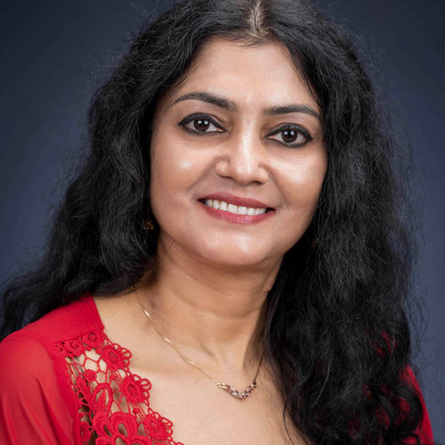 Headshot of Mita