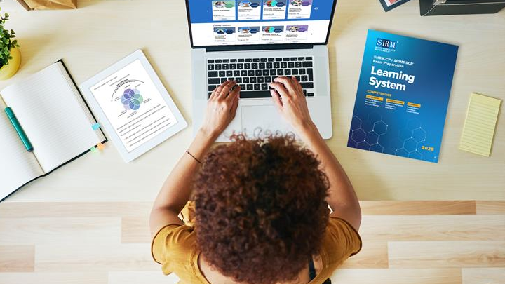 SHRMLS-2025_Woman-laptop-book-tablet_shutterstock_46