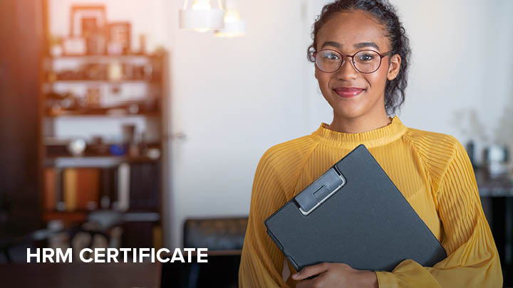 Image depicts a woman holding a binder