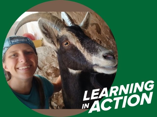 UW-Parkside student, Sirrenda Adams, poses with a goat for her Learning in Action story photo for Spring 2026