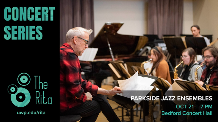 Jazz students rehearsing with the jazz professor flipping through sheet music.