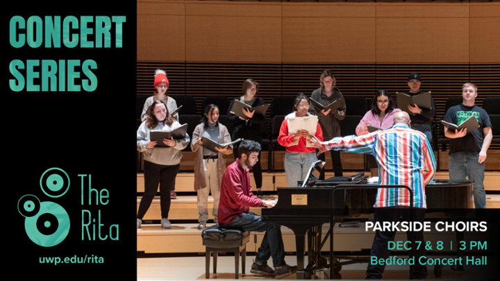 Choir students practicing in Bedford Hall with the conductor