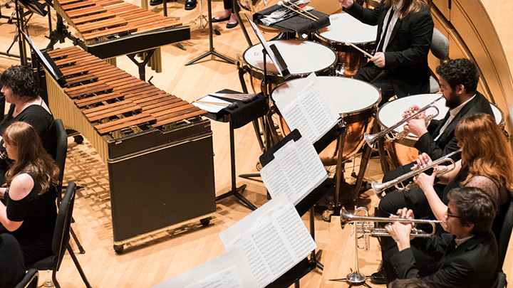 Students playing a variety of instruments in Bedford Hall