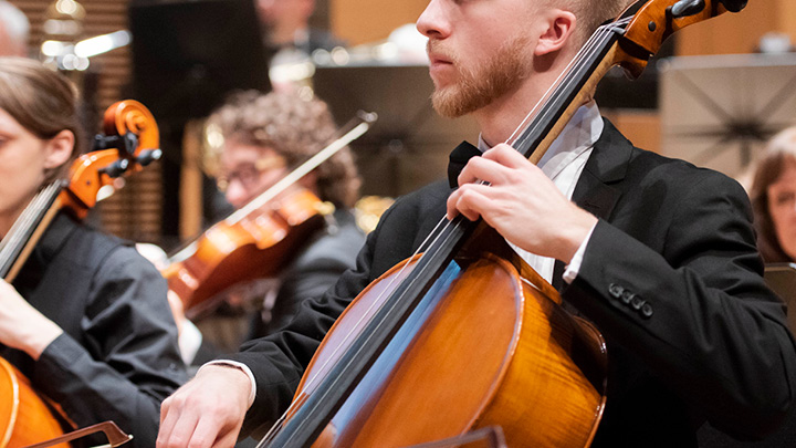 Student playing a cello