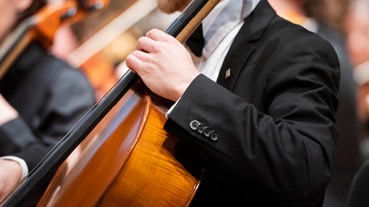 Student playing a cello